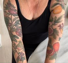 a woman with many tattoos on her arms