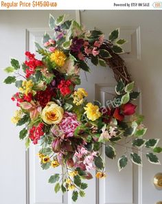 a floral wreath hangs on the front door