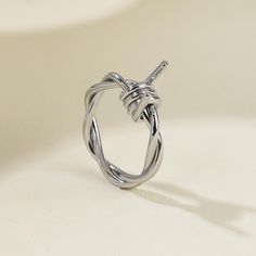 Discover the Edge with Our Barbed Wire Twisted Ring! Experience the thrill of exclusive styles delivered right to your door, thanks to our trusted suppliers who  ship directly to you. Enjoy unique designs and exceptional prices with zero hassle! 🔹 Product Description: Unleash your edgy side with our Barbed Wire Twisted Ring! This ring combines a striking barbed wire design with a twisted band, creating a bold and rebellious look. Perfect for those who embrace individuality and want to make a st Barbed Wire Ring, Wire Twisting, Minimalistic Ring, Edgy Rings, Goth Ring, Barb Wire, Twisted Ring, Wire Design, Wire Ring