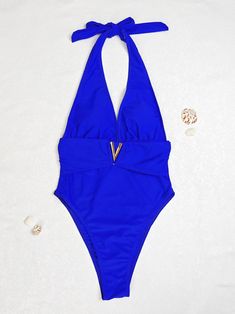 Indulge in the allure of the seaside with our Sexy Deep V Neckline One-Piece Bikini Swimsuit. This alluring swimsuit features a captivating deep V neckline that accentuates your curves, creating a sensual and sophisticated look. Crafted with high-quality materials, it offers both comfort and style for your beach adventures or poolside lounging. With its daring design and flattering fit, this bikini swimsuit is sure to turn heads wherever you go. Flaunt your confidence and embrace your femininity Backless Lined Swimwear For Beach Party, Beachwear V-neck Swimwear For Pool, Beachwear Style V-neck Swimwear For Pool, V-neck Swimwear For Pool And Beach, Backless One Pieces For Pool Beachwear, Backless One-piece Swimwear For Pool, Backless Beachy Swimwear For Pool, Backless Beachwear One-piece For Pool, Beachy V-neck Swimwear For Pool