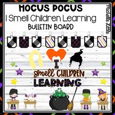 a sign that says hoccus pocus i smell children learning bulletin board with pictures of witches and pumpkins