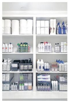 the shelves are filled with different types of toiletries and other items in plastic containers