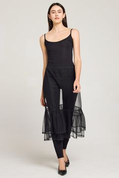 Slip into this: a versatile skirt in luxurious see-through tulle. This midi-length style has a flirty double flounce and looks stunning layered over leggings or jeans. Pop our Luxe Everyday Tank on top for a sleek look. 100% poly tulle Luxe, transparent tulle Made in Peru Body length: 30 ½” Machine wash Slip Skirt, Everyday Luxuries, Sleek Look, Skirts For Sale, Midi Length, Peru, Best Sellers, Everyday Essentials Products, Shop Now