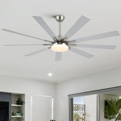 a ceiling fan with four blades in a living room