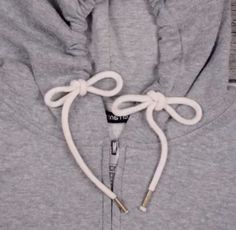 the hoodie is tied up and ready to be worn