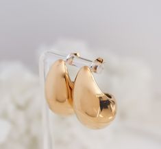 BUY ANY 2 ITEMS GET 35%  BUY ANY 4 ITEMS GET 40% AUTOMATIC DISCOUNT AT CHECKOUT, no code needed. Applies to OmnyahCo purchases only. Earring Material : Premium Stainless Steel, covered in real 18 Karat Gold Earring size: 1.2" Hypoallergenic Warranty: Lifetime Warranty against all rust or tarnish Packaging: White Velvet Pouch with String PACKAGING All items are individually packaged in protective opp bags inside OMNYAH branded white velvet bags with white string. Orders also include an exclusive Black Craft, Jewellery Bag, Hoops Gold, Gold Birthday, Black Gift Boxes, Birthday Gift For Her, Velvet Bag, Drop Earring, Jewelry Earrings Hoops