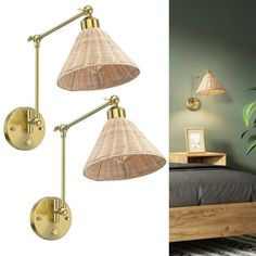 two wall lights are next to each other in a room with green walls and a bed