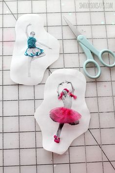 two pieces of paper cut out to look like ballerinas