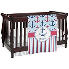 a baby crib bedding set with an anchor on it