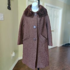 This Is Rare, Beautiful And In Excellent Vintage Condition. Very Classy. Fur Collared. Cute Bold Buttons. Slanted Front Pockets. Chocolate Brown Color. Size Is Marked, But A Medium, See Measurements Below. Length 43" Pit - Pit 22" Hg Retro Winter Outerwear With Button Closure, Retro Single-breasted Winter Outerwear, Retro Fitted Collared Outerwear, Vintage Collared Winter Outerwear, Vintage Fitted Winter Outerwear, Fitted Vintage Winter Outerwear, Retro Fitted Winter Outerwear, Retro Fitted Long Coat, Fitted Retro Long Coat