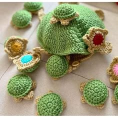 crocheted turtle and other items are laying on the floor