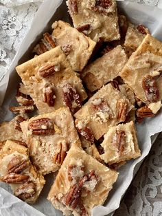 a bunch of pecan bars sitting on top of a table