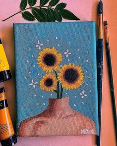 a painting of sunflowers in a vase on a pink surface next to pens and markers