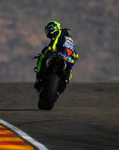 a person riding a motorcycle on a race track