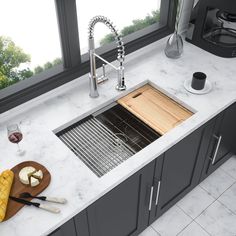 a kitchen sink with a cutting board on the counter