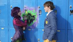 two young people standing in front of lockers