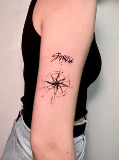 a woman with a tattoo on her arm that has the word sparkle written in it