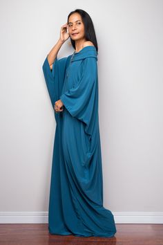 "Kaftan Dress, Teal Maxi Dress, Long boho dress, Loose fit dress PRODUCT SIZE : One Size Fits Most * Chest : free up to 60\" * Waist : free up to 60\" * Hips : free up to 60\" * Circumference bottom hem : 45\" * Length : 55\" * Sleeve length : 23\" MATERIAL * ITY Polyester MODEL : * Model chest : 32\", Height 160 cm (5.2) without high heel * Accessories excluded Produced by NUICHAN IMPORTANT NOTE *Please note that colours shown on your monitor may vary from the actual colour of the fabric. If yo Flowy V-neck Lagenlook Dress, Bohemian Flowy Maxi-length Abaya, Flowy Lagenlook Dress For The Beach, Flowy Lagenlook Beach Dress, Flowy Lagenlook Maxi Dress, Lagenlook Tunic Dress For Festivals, Festival Lagenlook Tunic Dress, Flowy Tunic Dress In Lagenlook Style, Bohemian Blue Maxi Abaya