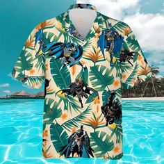 Batman Green Tropical Hawaiian Shirts The Hawaiian Shirt is an iconic symbol of laid-back, tropical style. Crafted from lightweight, breathable fabrics, it offers a comfortable and relaxed fit, perfect for warm weather escapades. Its vibrant, exotic patterns evoke the spirit of the Hawaiian islands, radiating a sense of fun and adventure. With its button-up design and collared finish, it strikes the perfect balance between casual and smart-casual attire. Whether you’re strolling along the beach Button-up Hawaiian Shirt With Tropical Print For Beach, Hawaii Shirts, Affordable Multicolor Hawaiian T-shirt, Multicolor Hawaiian Relaxed Fit T-shirt, Multicolor Hawaiian Graphic Print T-shirt, Branded Outfits, Multicolor Hawaiian Printed T-shirt, Tropical Colors, Summer Soiree