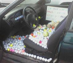 a car filled with lots of balls and rocks