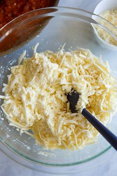 cheese and other ingredients in a glass bowl