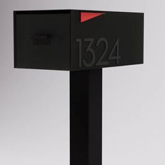 a black mailbox with the number 1234 on it's front and side