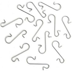 some metal hooks are arranged in the shape of letters and numbers on a white background