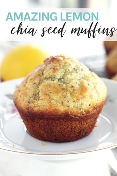 a close up of a muffin on a plate with lemons in the background