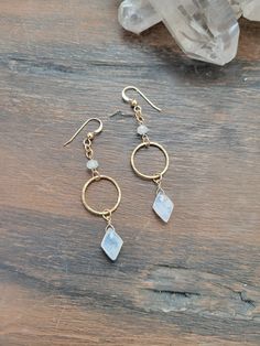 Beautiful and dainty Moonstone Circle Drop Earrings. These beauties are light and easy to wear. They easily can be dressed up or down. The circle is hammered for texture and shine. Attached to the top of the circle is a cute petite Moonstone and to the bottom is a diamond shaped Moonstone. The length is just over 1 3/4 in. All materials are 14k Gold Filled or Sterling Silver. Each piece is handmade and may vary slightly as well as the stones as they are natural. Some stones will be more white and some a rainbow flash to them. If you have a preference, please let me know and I will do my best to accommodate.  Thank you! Handmade Jewelry Tutorials, Earrings Inspiration, Classy Jewelry, Beaded Dangle Earrings, Diy Schmuck, The Circle, Diamond Shaped, Gold Earrings Dangle, Bijoux Diy