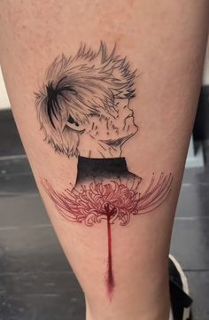 an artistic tattoo on the leg of a person with blood dripping from his mouth and head