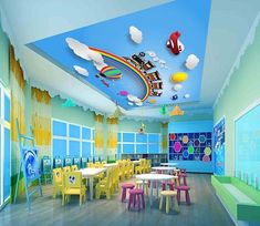 this is a children's playroom with colorful furniture and decorations on the ceiling