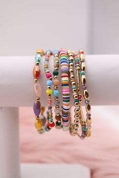 Enhance your accessory game with our Gold Mixed Up Multicolored Beads Bracelet Set. This set features a mix of gold and multicolored beads for a unique and stylish look. Perfect for any occasion, you'll love the versatility and eye-catching design of this set. Elevate your style with this must-have accessory. Size: 6.5” - Inner Diameter Closure: Elastic Material: Zinc, Brass and Steel with Rhodium Plating Lead and Cadmium Safe - It is not Nickel Free Adjustable Multicolor Jewelry With Gold Beads, Multicolor Stackable Beaded Bracelets For Party, Gold Heishi Beads Bracelet With Colorful Beads, Multicolor Friendship Bracelets With Gold Beads As Gift, Multicolor Metal Beaded Bracelets, Trendy Gold Beaded Bracelets With Heishi Beads, Trendy Gold Beaded Bracelets With Colorful Beads, Gold Friendship Bracelets With Colorful Beads For Parties, Trendy Gold Friendship Bracelets With Colorful Beads