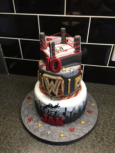 a cake that is sitting on top of a table with a wrestling ring on it