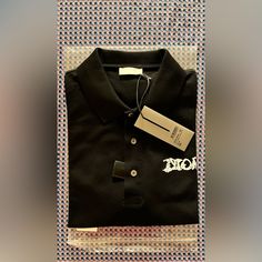 New With Tags. Luxury Collared Shirt, Luxury Black Cotton Shirt, Designer Black Cotton Shirt, Luxury Black Collared Shirt, Black Polo Collar Top For Formal Occasions, Elegant Black Polo Collar Top, Luxury Black Tops For Workwear, Luxury Black Formal Tops, Luxury Black Shirt For Work