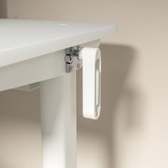 a close up of a white table with a handle on it