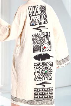 Embrace the artistry of ancient symbols with the Tribal Sunrise Kimono. Crafted from lightweight cotton, this one-size-fits-all piece blends bohemian vibes with tribal patterns for a truly standout look. The bold black prints on an ivory canvas evoke timeless stories, while the intricate border detailing adds a touch of refined elegance. Perfect as a statement layer for festivals, beach days, or casual luxe style. • One size fits most • Open-front, long sleeves • Hand-drawn tribal motifs • Soft, Bohemian Wardrobe, Black Prints, Casual Luxe, Beach Kimono, Bohemian Vibes, Boho Handmade, Boho Kimono, Ancient Symbols, Handmade Boho