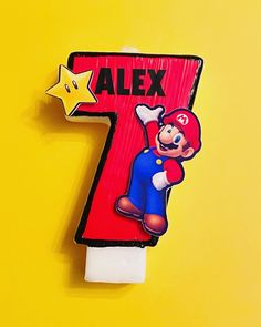 a wooden number seven with a mario bros character on it and a star in the middle