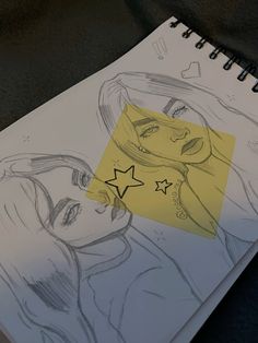 a drawing of two women with stars on their foreheads and one has a yellow piece of paper in front of them