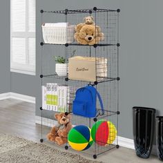 three tiered storage rack with teddy bears and other items