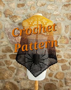 a crochet shawl with the words crochet pattern on it in front of a stone wall