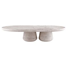 an oval concrete table with two pedestals on each side