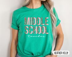 "Middle School Teacher Shirt, 6th Grade, 7th Grade, 8th Grade Teacher Squad Middle School Teacher Gift, Teacher Appreciation, Gift Teacher tee This comfortable T-shirt is a perfect gift idea as a birthday gift, Christmas Present, or any special occasion for your best friends or your family members or anyone who you love and a really great way of putting a smile on their faces. Retail fit 100% Soft cotton (fibre content may vary for different colors) Light fabric (4.2 oz/yd² (142 g/m Tear away la Green School Spirit Top, Green School Tops With Text Print, Green Text Print Top For School, Green Text Print School Tops, Green Graphic Print Shirt For School, Green Text Print Tops For School, Green Graphic Print Tops For School, Green Tops With Graphic Print For School Spirit, Green Letter Print Top For School