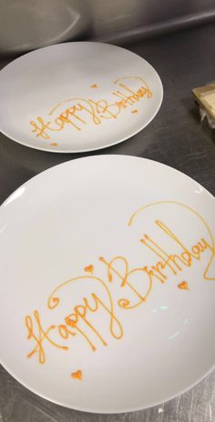 two plates with happy birthday written on them