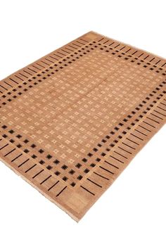 a brown rug with black dots on the top and bottom, in front of a white background