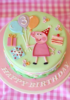 a birthday cake with pep the pig on it