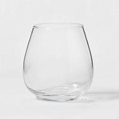 a glass filled with water sitting on top of a table