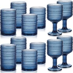 six blue glass goblets sitting next to each other