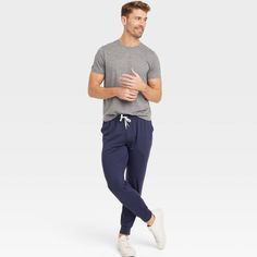 Why we're ALL IN: Solid-hued jogger pants are made with quick-dry fabric with moisture-wicking properties to offer cool comfort and help keep you dry during a range of activities. Designed in an athletic fit in a mid-rise silhouette with a full elastic waistband. Side pockets and a side zipper pocket complete the look with space for on-the-go essentials. All in Motion™: Made for every move, priced for every day. Comfort Stretch Moisture-wicking Sweatpants, Casual Navy Activewear Long Pants, Navy Relaxed Fit Joggers For Loungewear, Blue Moisture-wicking Sweatpants For Loungewear, Navy Casual Activewear For Loungewear, Moisture-wicking Joggers, Navy Casual Activewear For Jogging, Casual Blue Moisture-wicking Joggers, Moisture-wicking Relaxed Fit Joggers