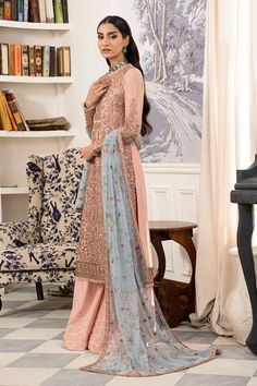 Elegant Peach Shade Embroidered Pakistani Salwar Kameez Suit is an epitome of royalty and grace adorned with threads and embroidery. Hand-crafted details of tilla, sequins, pearls, and floral designs make this Pakistani Dress your foremost priority for the Parties. Pakistani Kameez: The kameez has an alluring Peach color and it is emblazoned with embroidery, threads, and floral designs. Glamorous sequins and pearls make this beautiful kameez in chiffon fabric a perfect choice to wear at the wedd Long Shirt With Plazo, Shirt With Plazo, Organza Suits, Pakistani Designer Suits, Net Dress, Pakistani Salwar Kameez, Chiffon Collection, Maria B, Salwar Kameez Designs