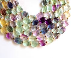 Rainbow Fluorite Gemstone Smooth Briolette's | Natural Fluorite Ovals Beads Size - 8x10 -- 8x12 MM 8 Inch Fluorite Nuggets [NFBA 11] Gemstone -- 100% Natural Length -- 8 Inch Shape -- Oval / Nuggets Cut -- Brilliant Faceted Size - 8x10 -- 8x12 MM Approx. Transparency -- Translucent Quality -- Top Quality Luxury Briolette Gemstone Beaded Necklace, Oval Faceted Beads For Jewelry Making, Natural Stone Oval Beads For Jewelry Making, Natural Oval Beads Gemstones For Jewelry Making, Oval Natural Stones For Jewelry Making, Handmade Oval Bead Gemstones For Jewelry Making, Oval Stones For Jewelry Making, Fluorite Gemstone, Briolette Necklace